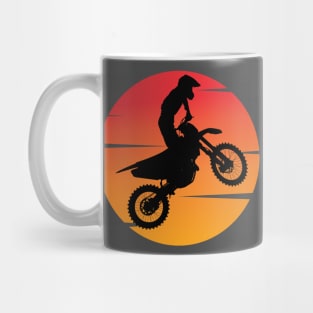 motocross silhouette jumping in front of the afternoon sun Mug